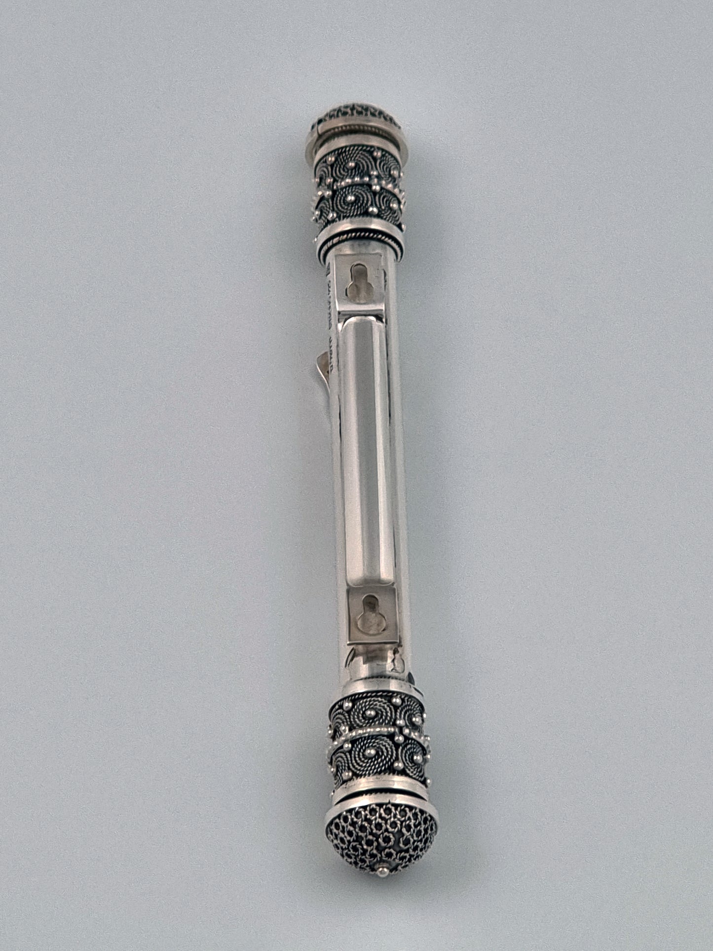 Back side of Hulda Mezuzah, showing two keyhole hangers.