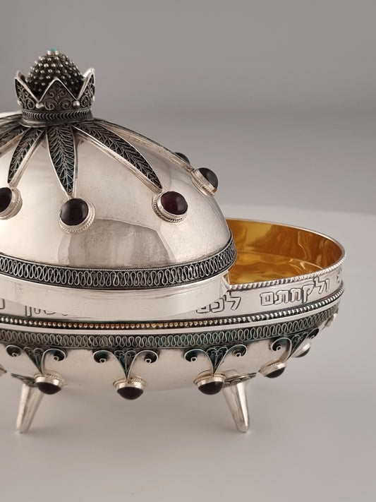 Etrog box slightly open, revealing the deep gold plated color of the inside.