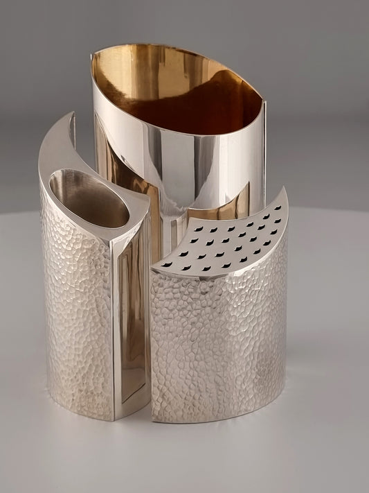 Malka Havdalah Set. This set was designed in 2005, measures 6” by 5”, and is made of sterling silver and gold-plated silver.