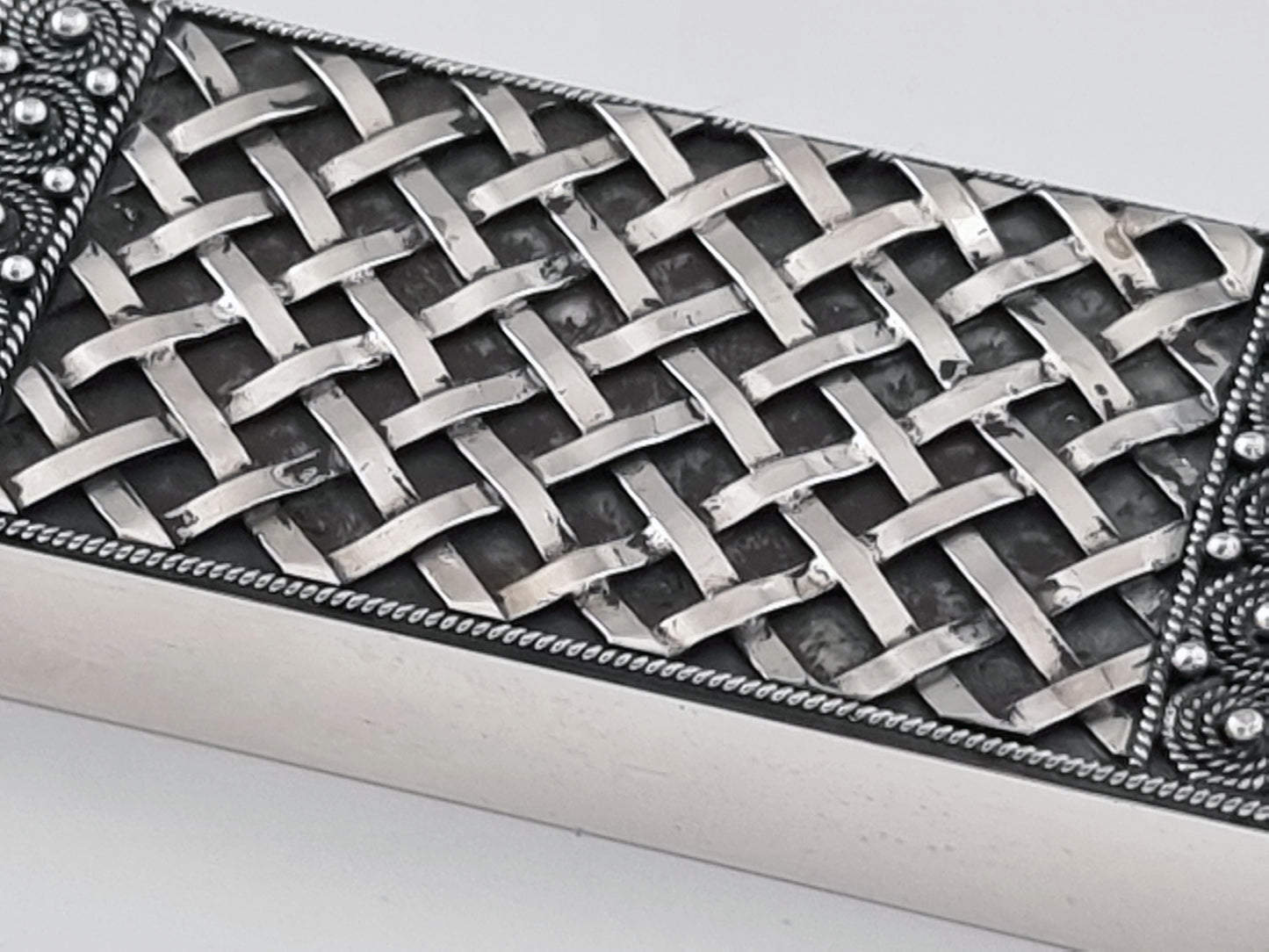 Fine lattice framed with filigree on a Chumash Mezuzah