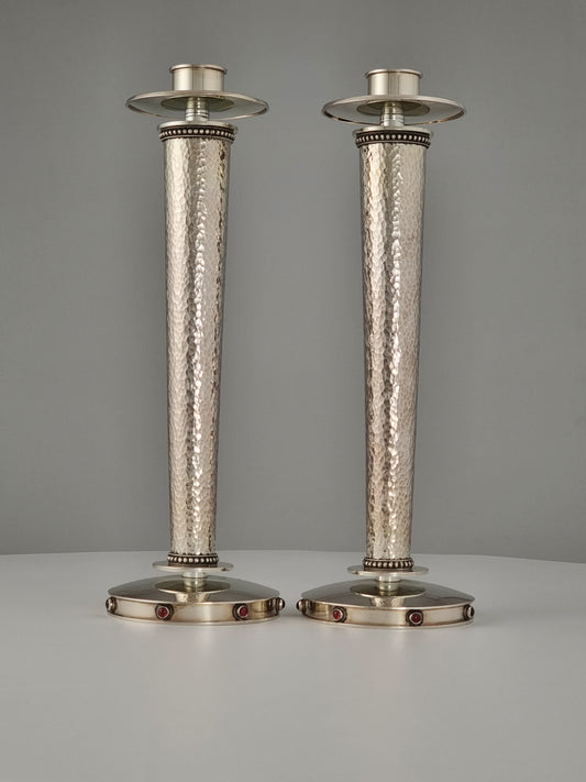 Sarah Candlesticks. These candlesticks were designed in 1999 in sterling silver and garnet stones. They are 10” high. 