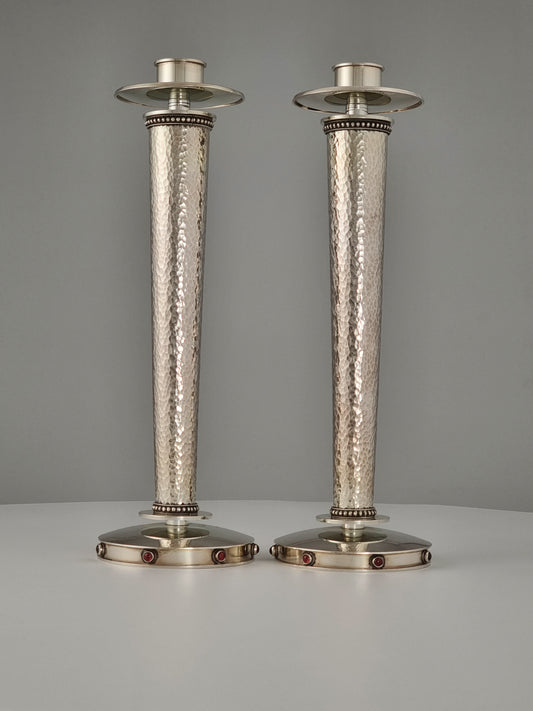 Sarah Candlesticks. These candlesticks were designed in 1999 in sterling silver and garnet stones. They are 10” high.