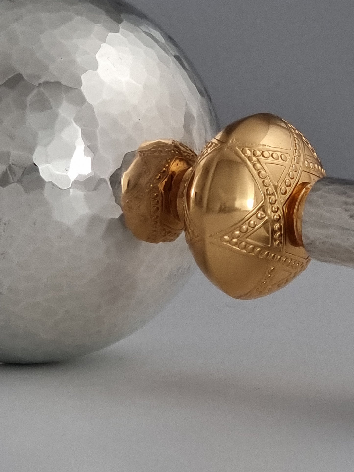 Hammered base and top of cup with a golden star of David