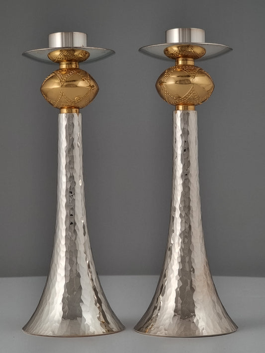 A pair of candlesticks bearing the star of David