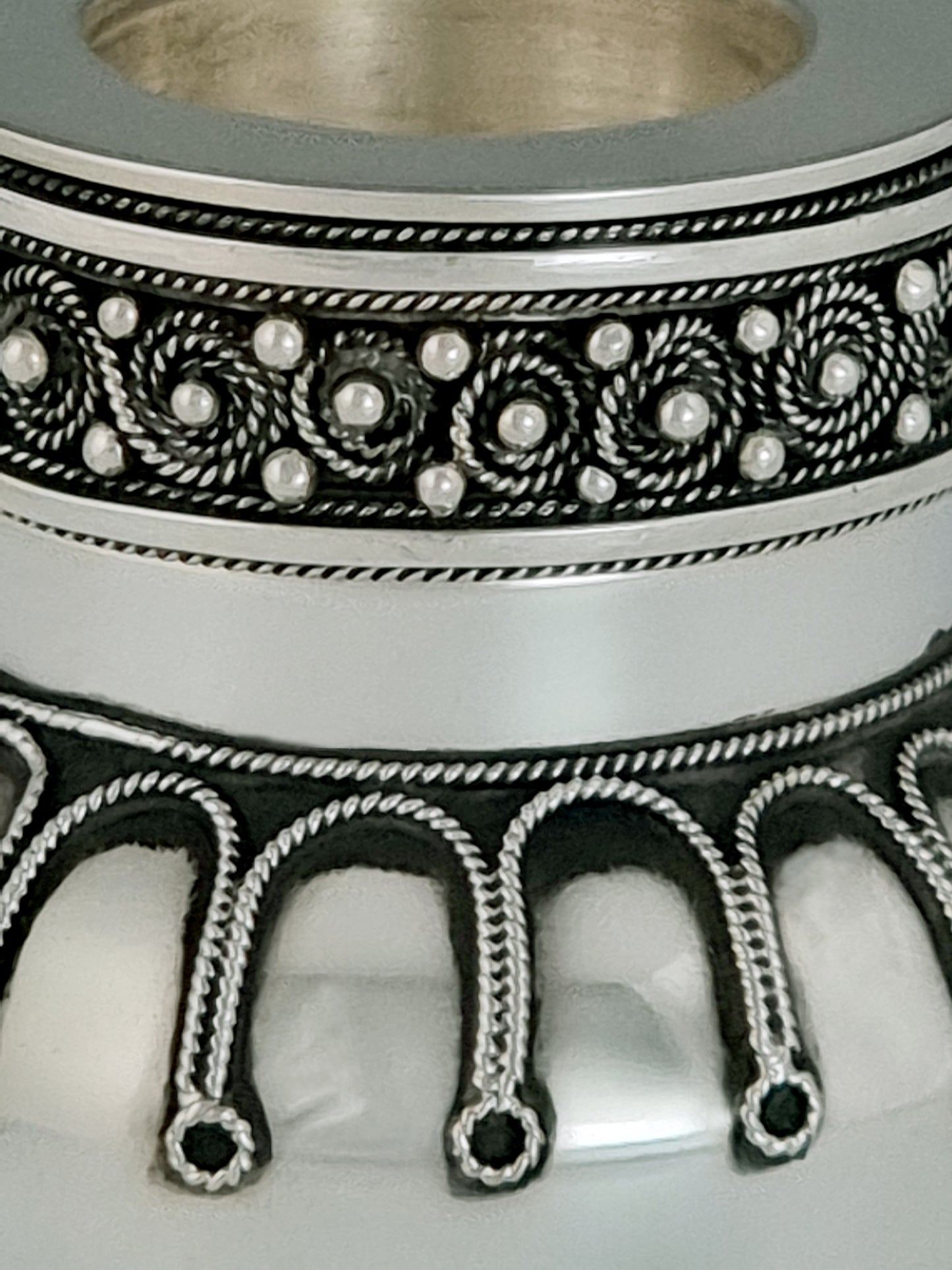 Elijah candlesticks close-up, showing the detailed filigree.
