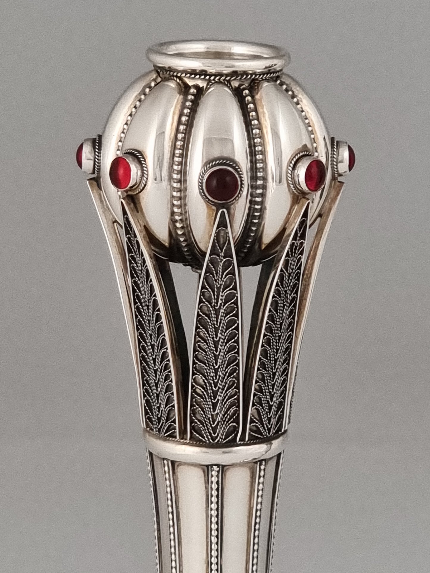 Superior filigree technique was employed in the creation of the countless details of the Jacob candlesticks.