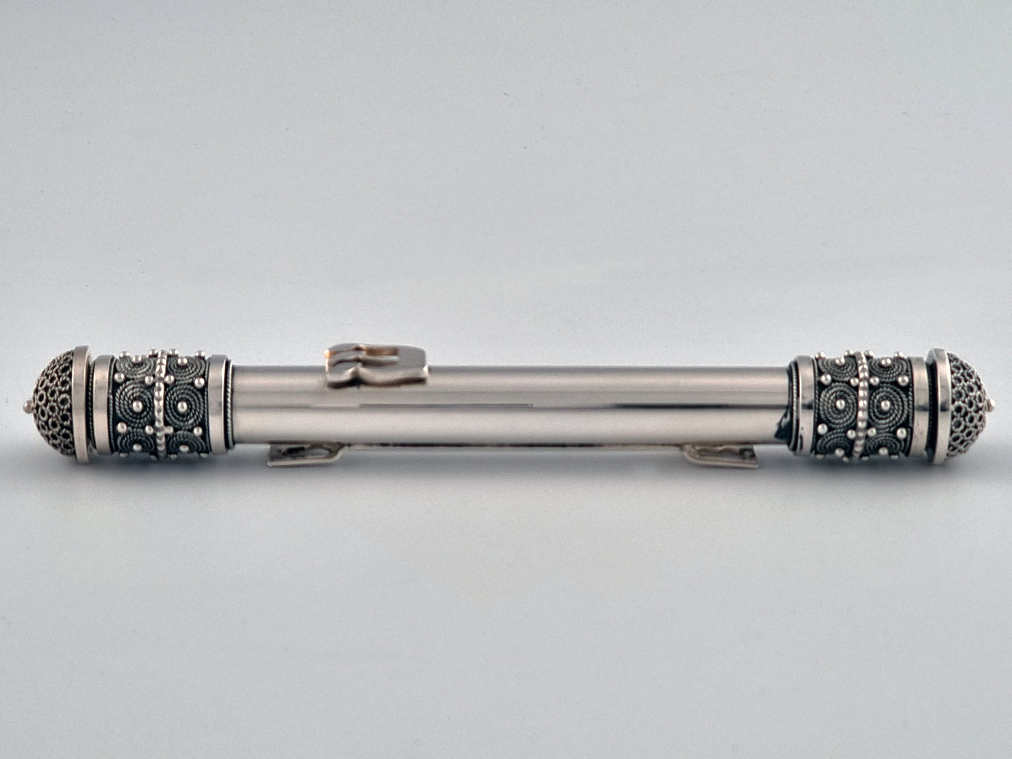 Luxurious Mezuzah made in Jerusalem. The center is shiny and the ends dark and detailed.