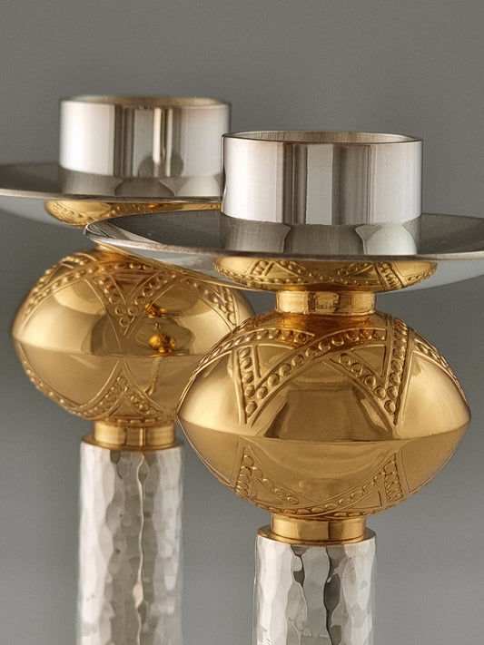 David Candlesticks. These candlesticks were designed in 1993 and are made of silver and gold-plated silver. They measure 7½” high.