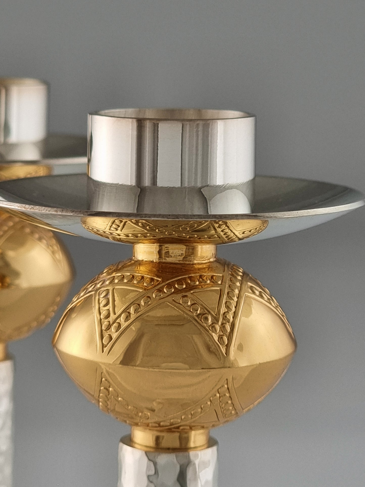 Close-up of David candlesticks showing the star of David and its reflection