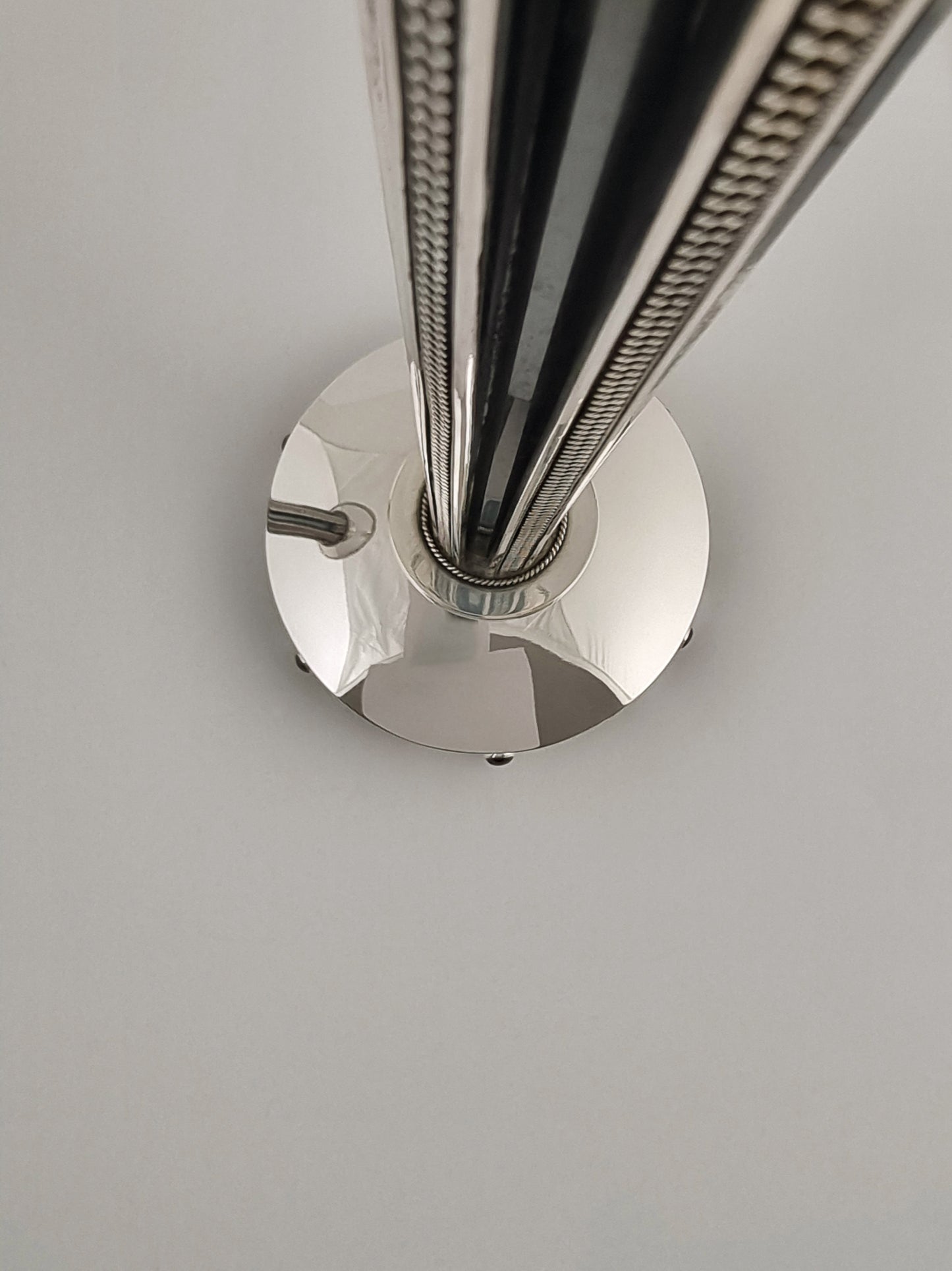 Long deep crevices make up the center of our Isaac candlesticks.