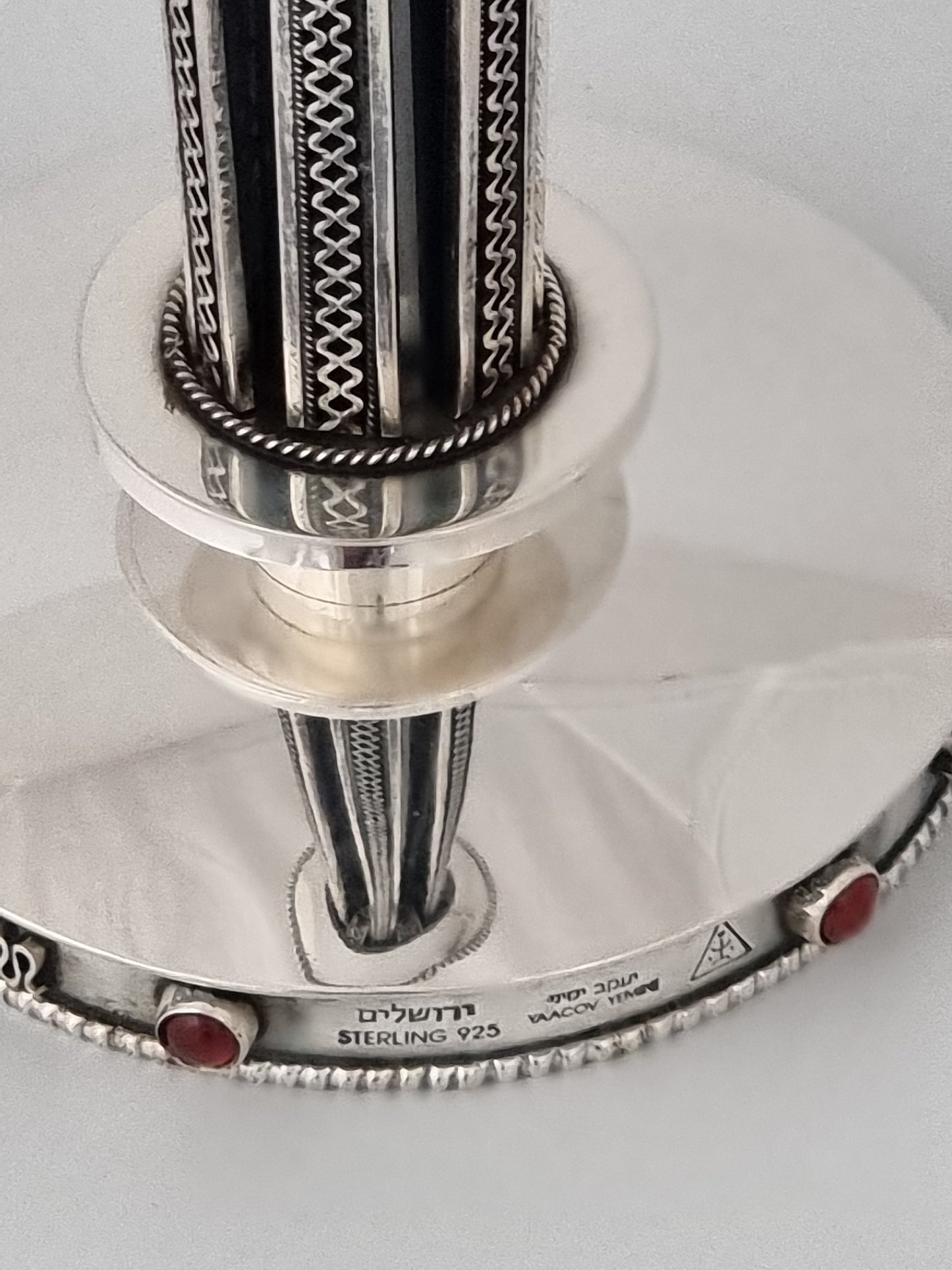 The stunning pillar reflects on two shiny surfaces at the base.