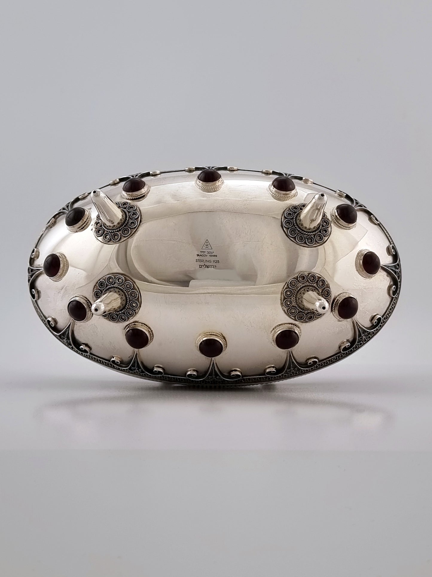 Stamped bottom showing perfect symmetry of the twelve stones arranged around four legs.