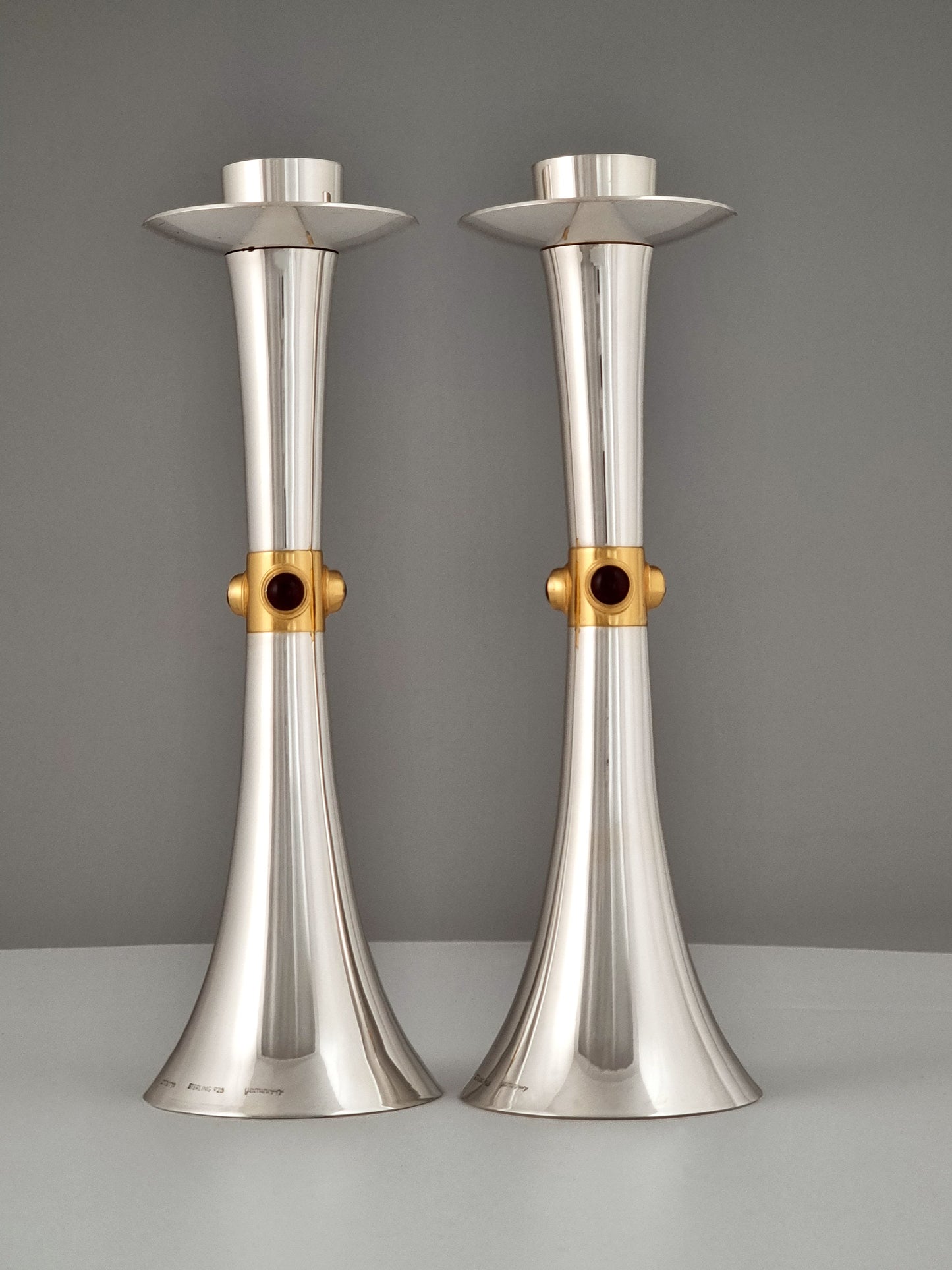 Deborah candlesticks bearing garnet stones