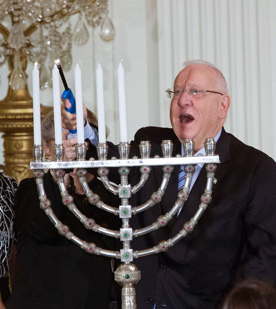 President of Israel Reuven Rivlin, lighting a Yemini Hanukkiah