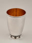 Sarah Kiddush Cup. This cup was designed in 1999. It is made of sterling silver, gold-plated silver on the inside, and adorned with seven garnet stones. It measures 4½" high.