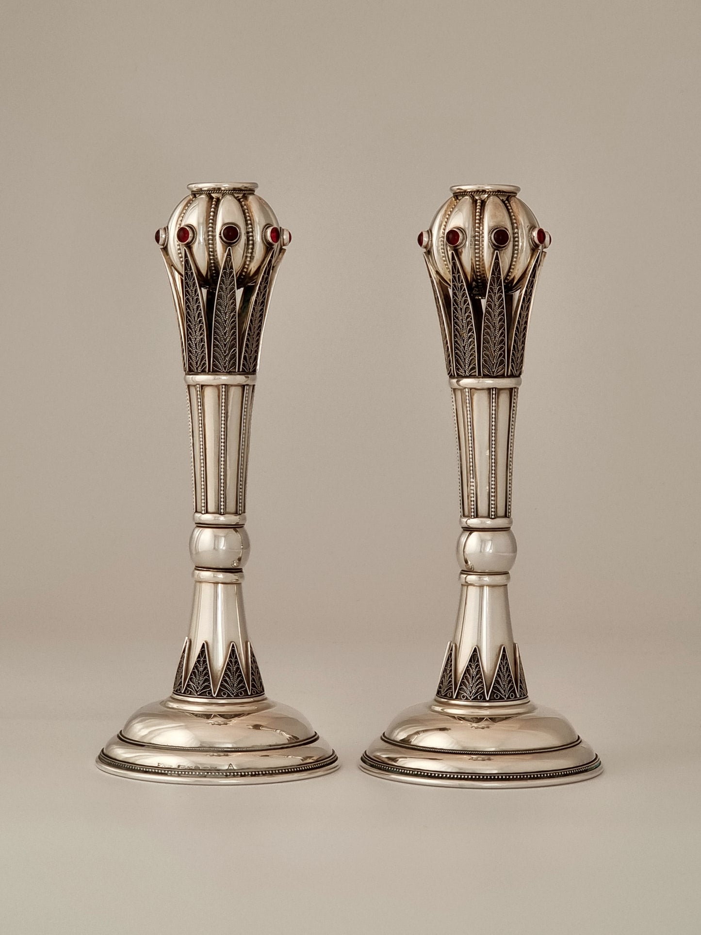 Jacob Candlesticks. These candlesticks were designed in 1998 and made of sterling silver and garnets, seven stones per stick. They are 10” high.