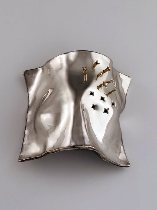 Cloves Spice Box. This out-of-the-ordinary piece was designed in 1995 and created in sterling silver, oxidized silver, and 14 K gold. It measures 4½” by 4” by 2½”.