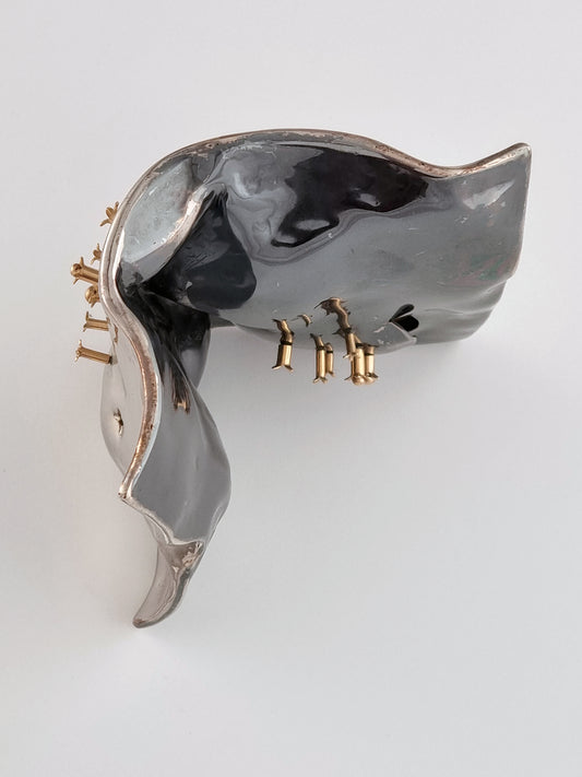 Spice box with golden cloves on both faces