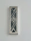 Solomon Mezuzah. This mezuzah was designed in 1995. It is made of sterling silver and measures 5" long and 1½" wide.