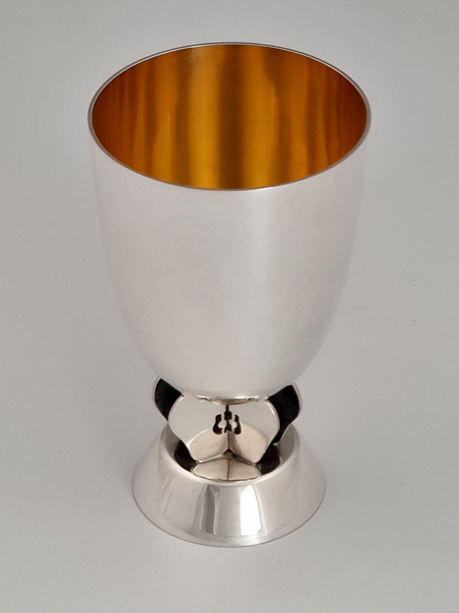 Apple kiddush Cup. This cup was designed in 2005. It is made of sterling silver and measures 4½" high.