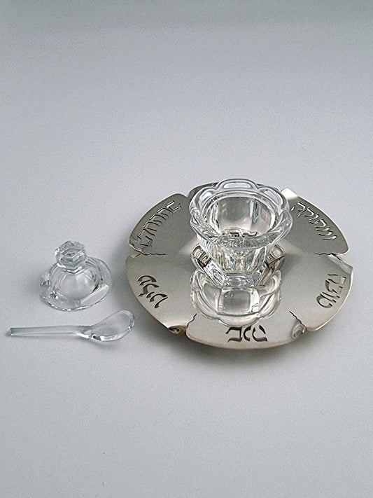 Abigail Honey Dish. This dish was designed in 1994 and is made of sterling silver, measuring 8” in diameter.