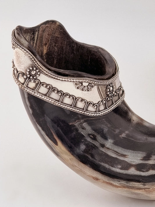 Abraham Shofar. A natural ram's horn embellished with sterling silver filigree bands custom-made to fit the curves of the horn in the most harmonious way.