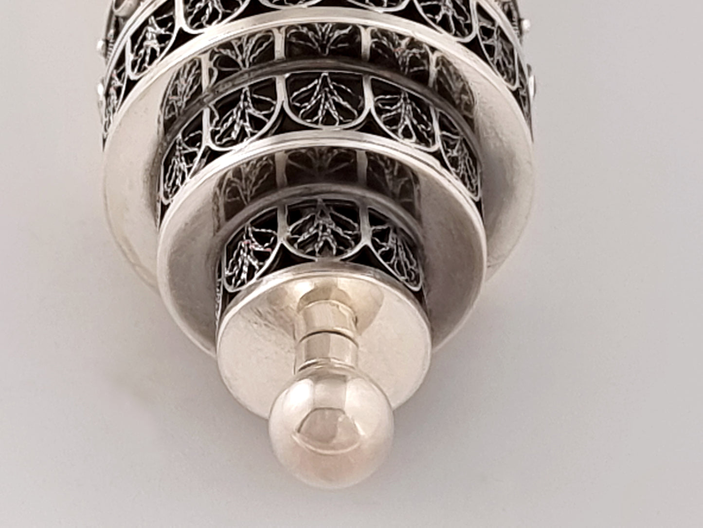 A polished silver ball at the top of our Esther scroll.