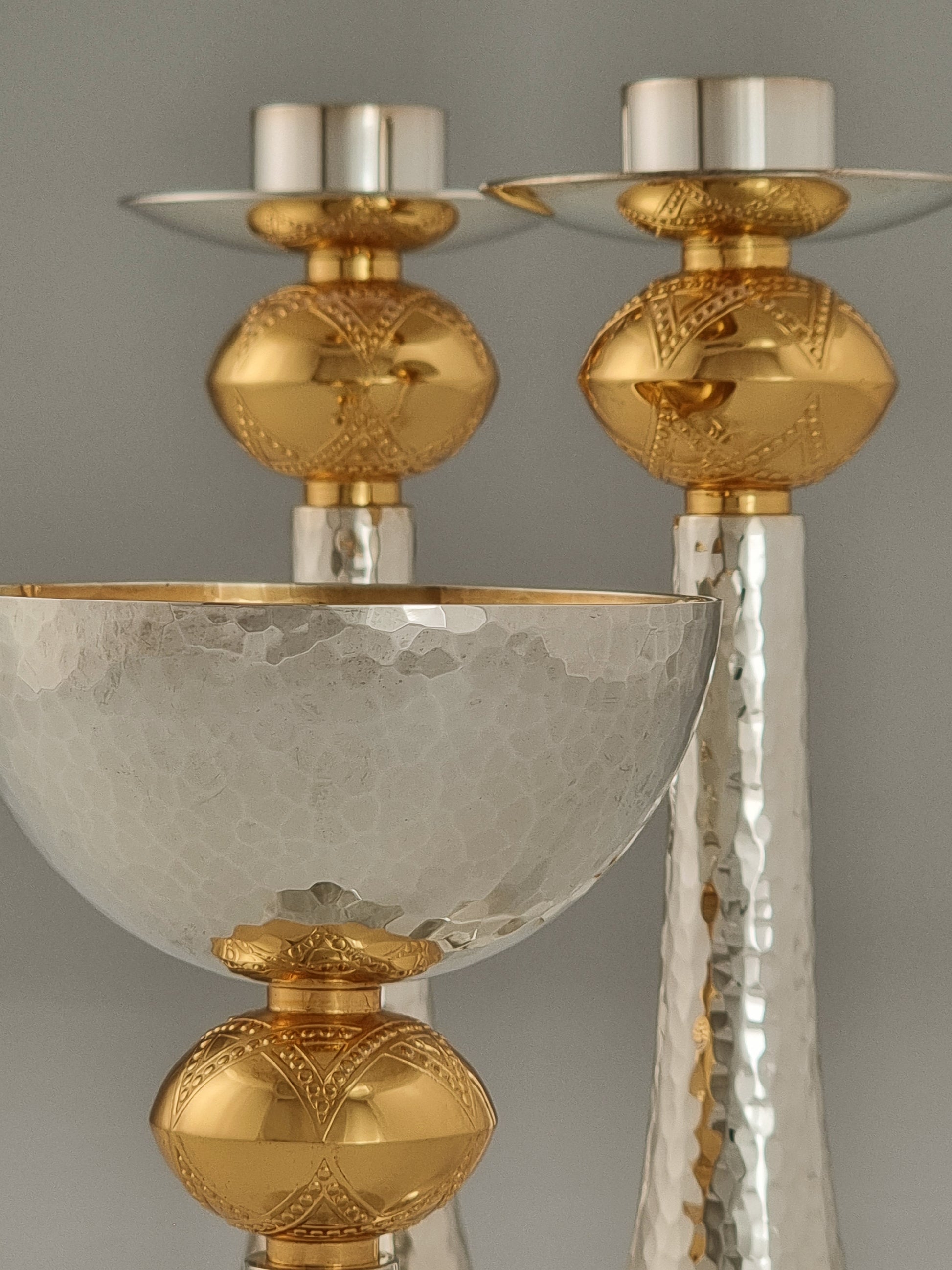 David Kiddush Set. This set was designed in 1993 and is made of silver and gold-plated. The cup is 5” high and the candlesticks are 7½“ high.