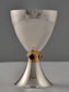 Smooth sterling silver Kiddush cup with a golden ribbon and garnets