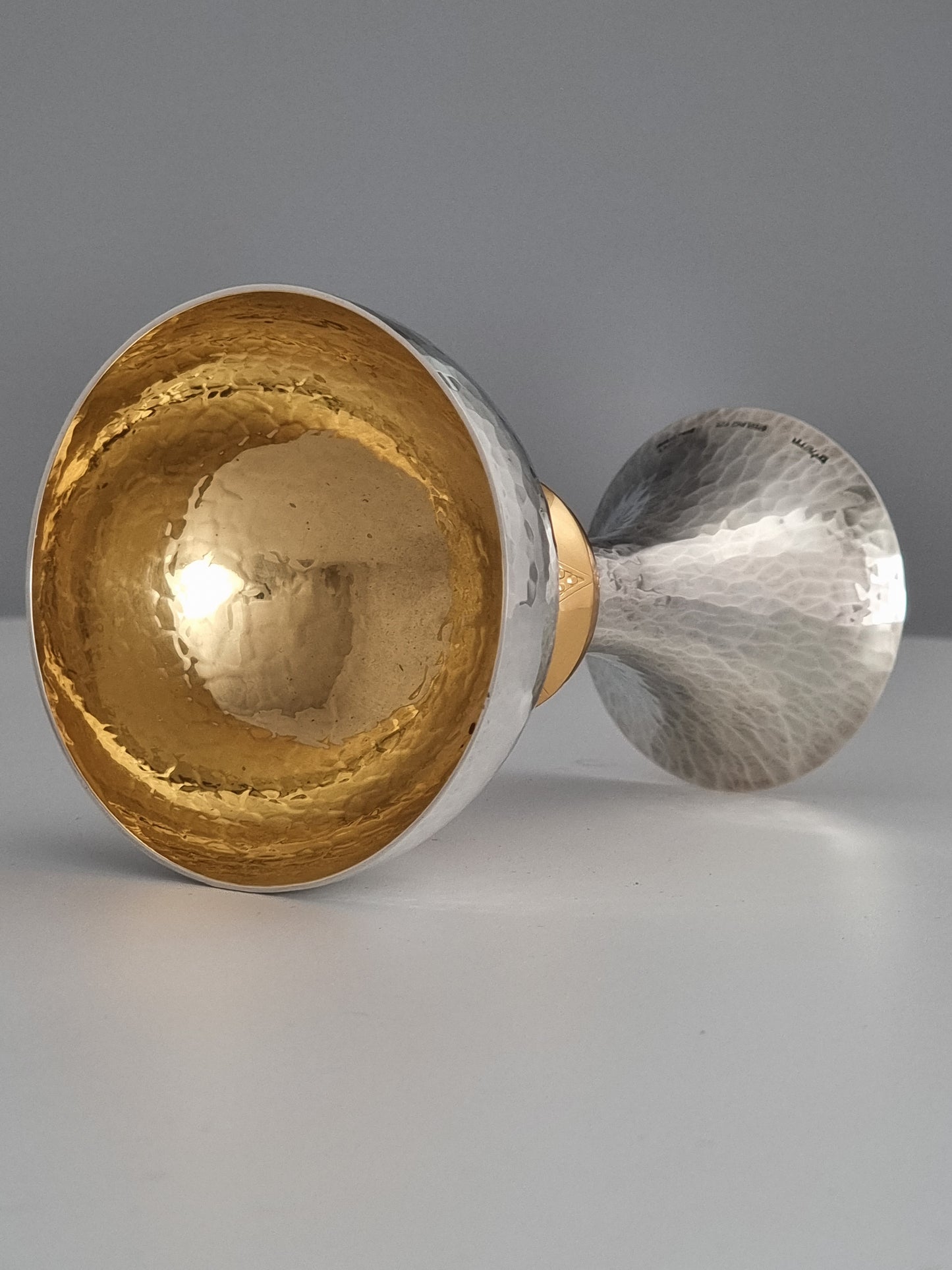 Hammered silver Kiddush cup gold plated on the inside