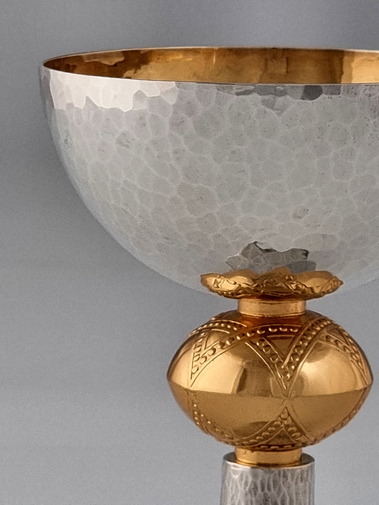 David Kiddush Cup. This cup was designed in 1993. It is made of sterling silver and is gold-plated on the inside. It measures 5" high.