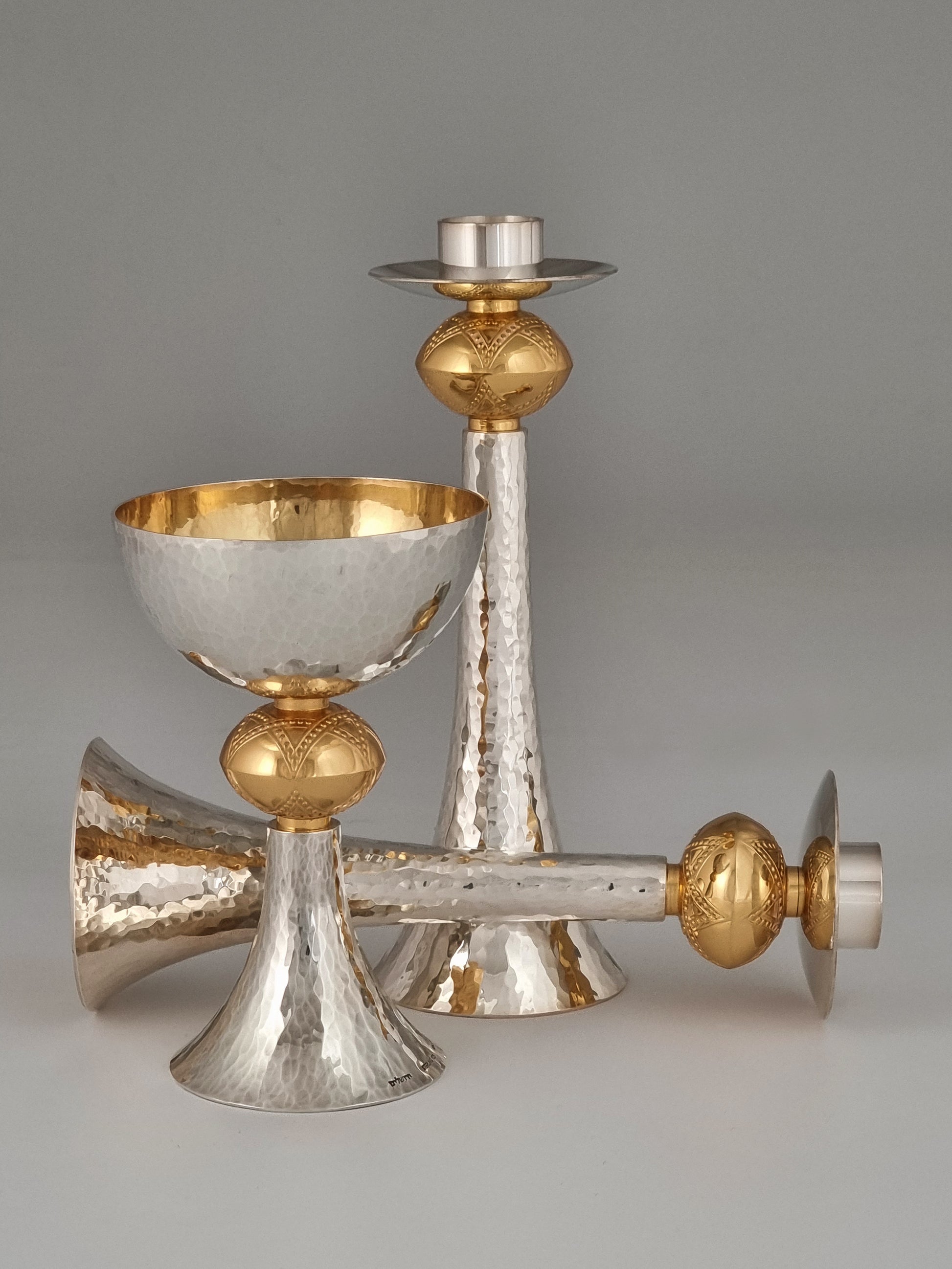 Yemini Kiddush set comprised of a David Kiddush cup and David candlesticks