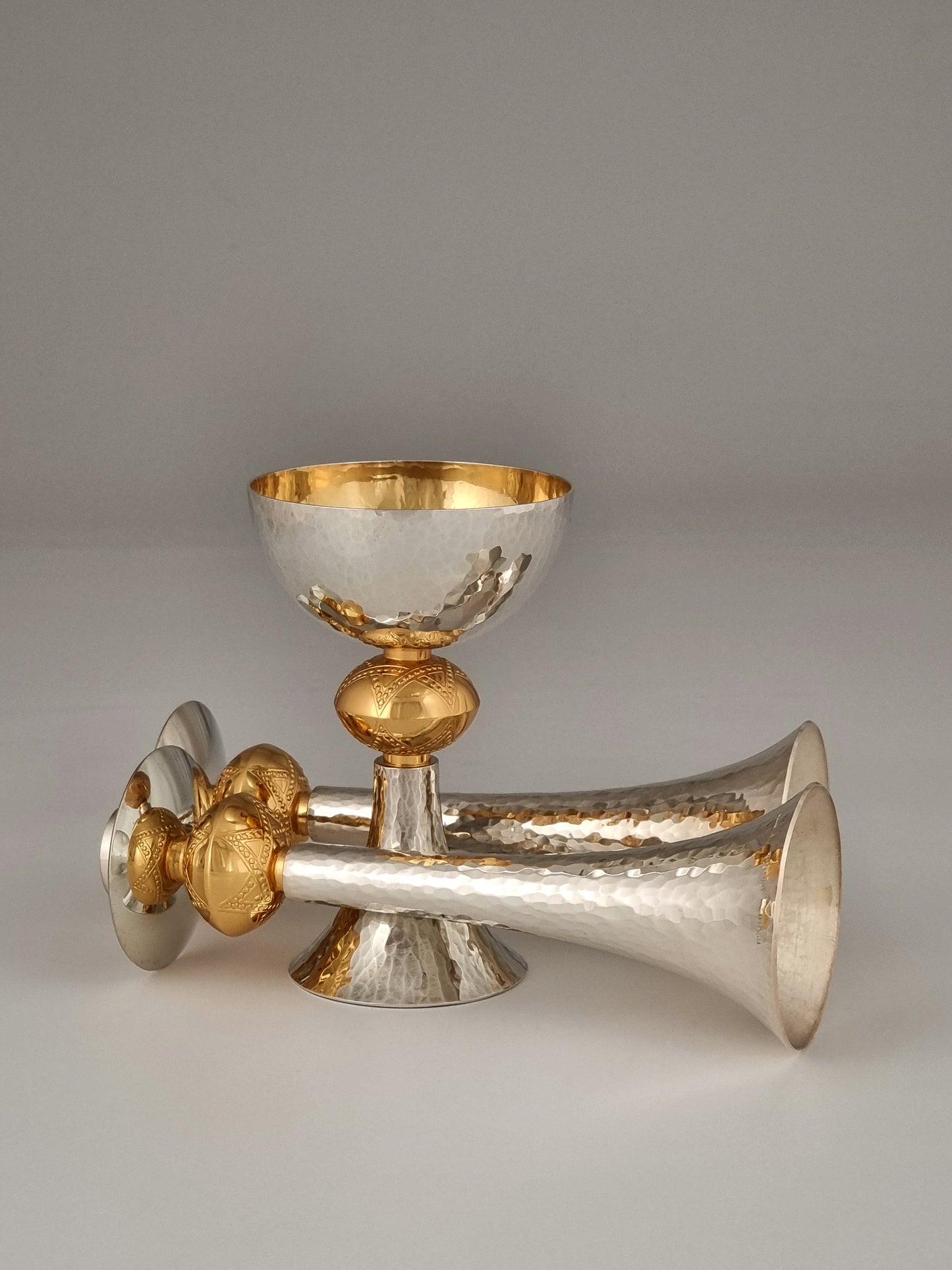 Kiddush cup with a pair of candlesticks, all bearing the star of David