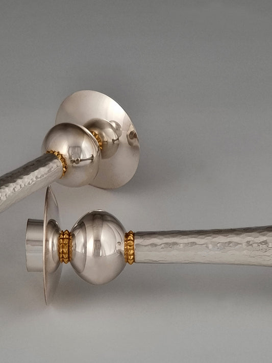 Jeremiah Candlesticks. These candlesticks were designed in 1993 and are made of silver and gold-plated silver. They are 7½” high.