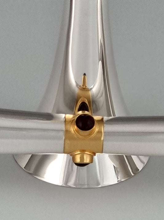 Deborah Candlesticks. These candlesticks were designed in 1993 and are made of silver and gold-plated silver and three garnet stones per stick. They measure 7½” high.