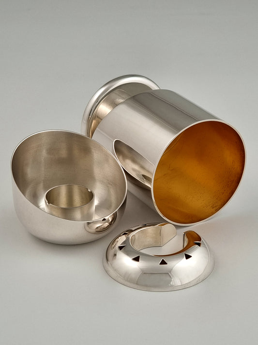 Hannah Havdalah Set. This set was designed in 1989 and made of sterling silver and gold-plated silver, measuring 4½” by 3”.