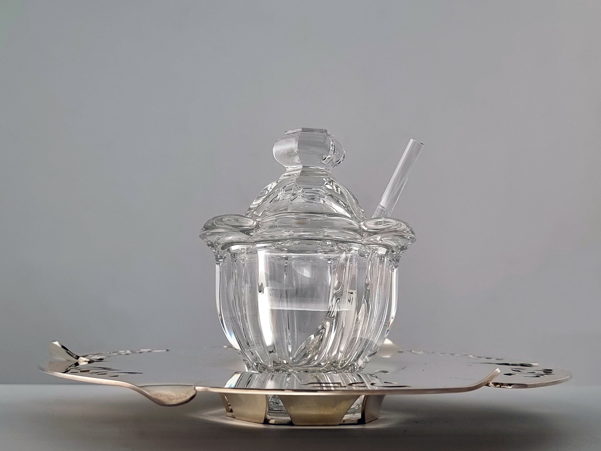 Front low view of Honey Dish with jar and spoon. 