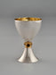 Deborah Kiddush Cup. This cup was designed in 1993. It is made of sterling silver, gold-plated silver on the inside, and adorned with three garnet stones. It measures 5" high.